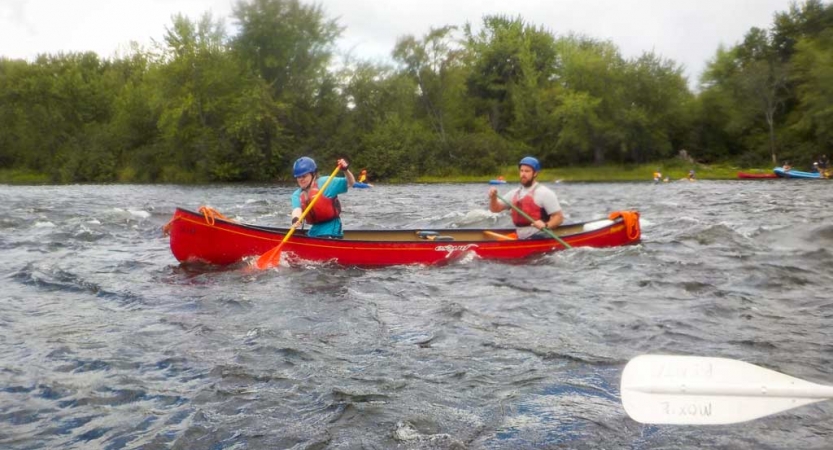 two veterans navigate a canoe on an outward bound expedition